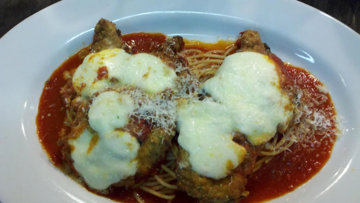 Chicken Parmesan with fresh mozzarella and tomato sauce